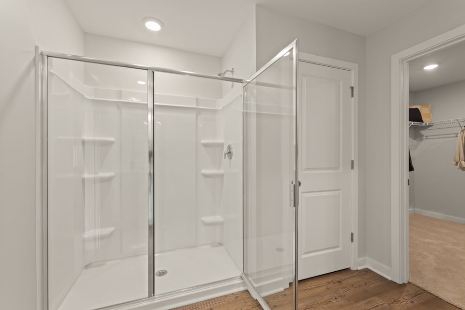 A bathroom with a glass shower.