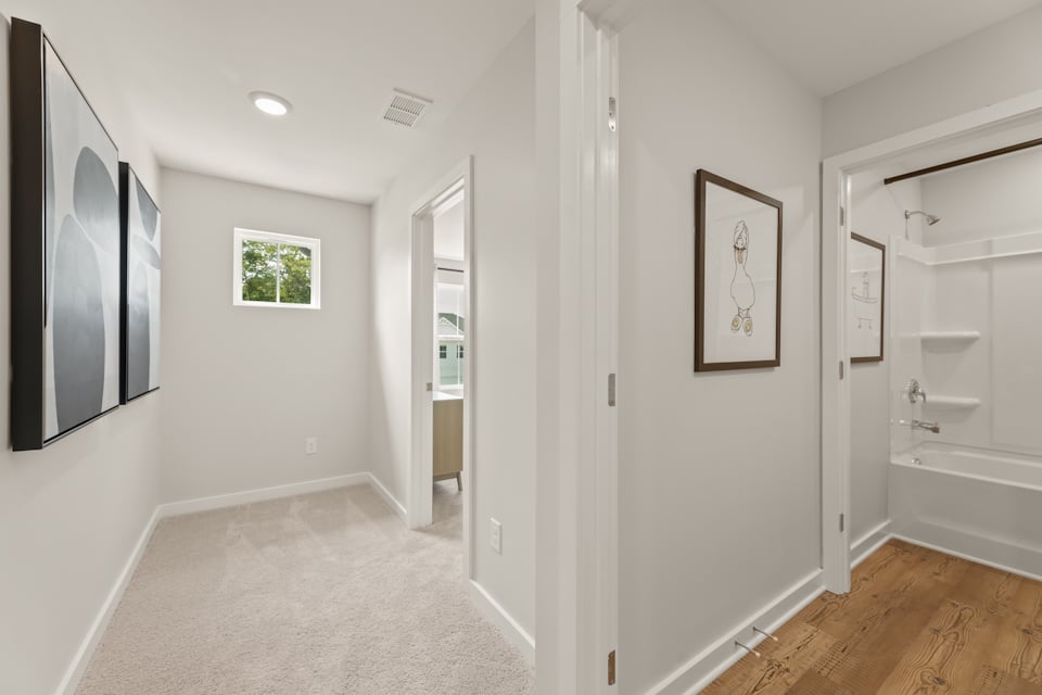 A bathroom with white walls.