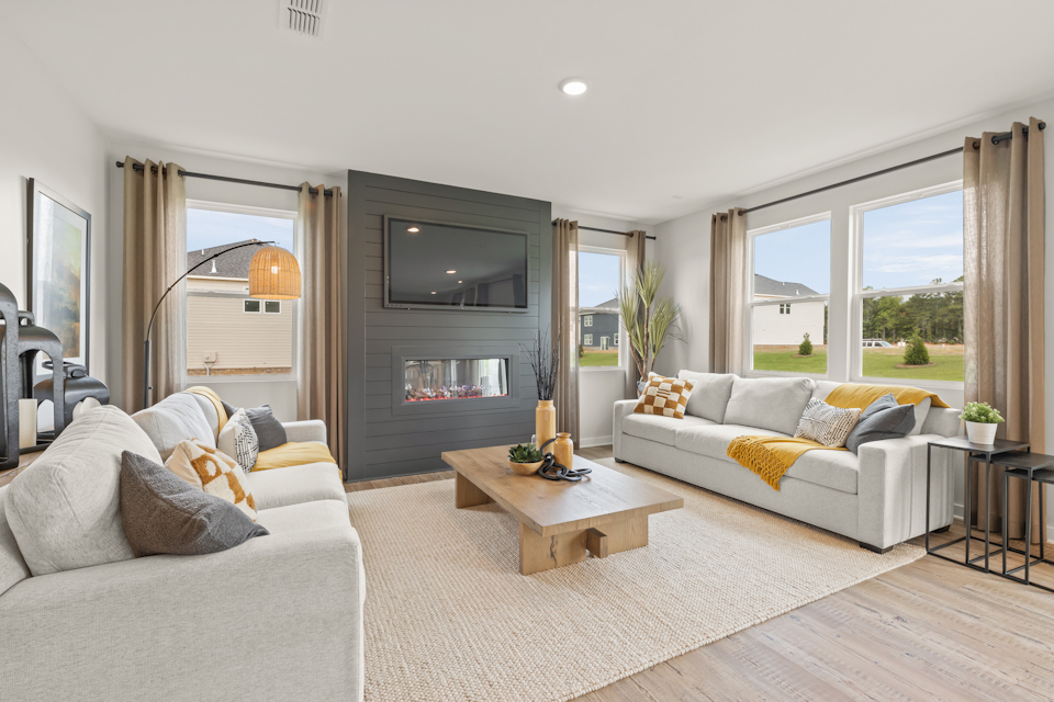 A living room with a fireplace.