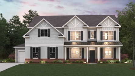 A house with a lawn in front.