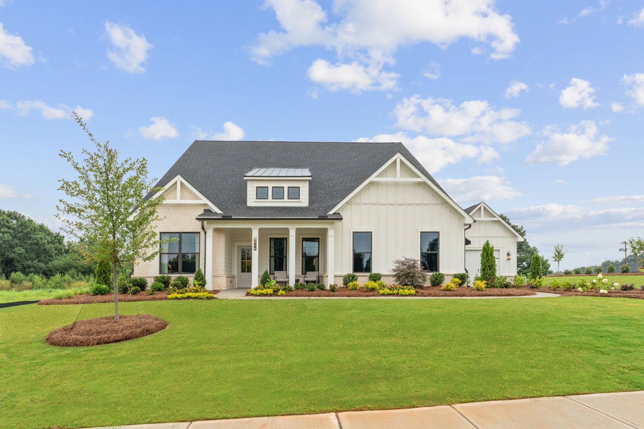 A large house with a lawn.