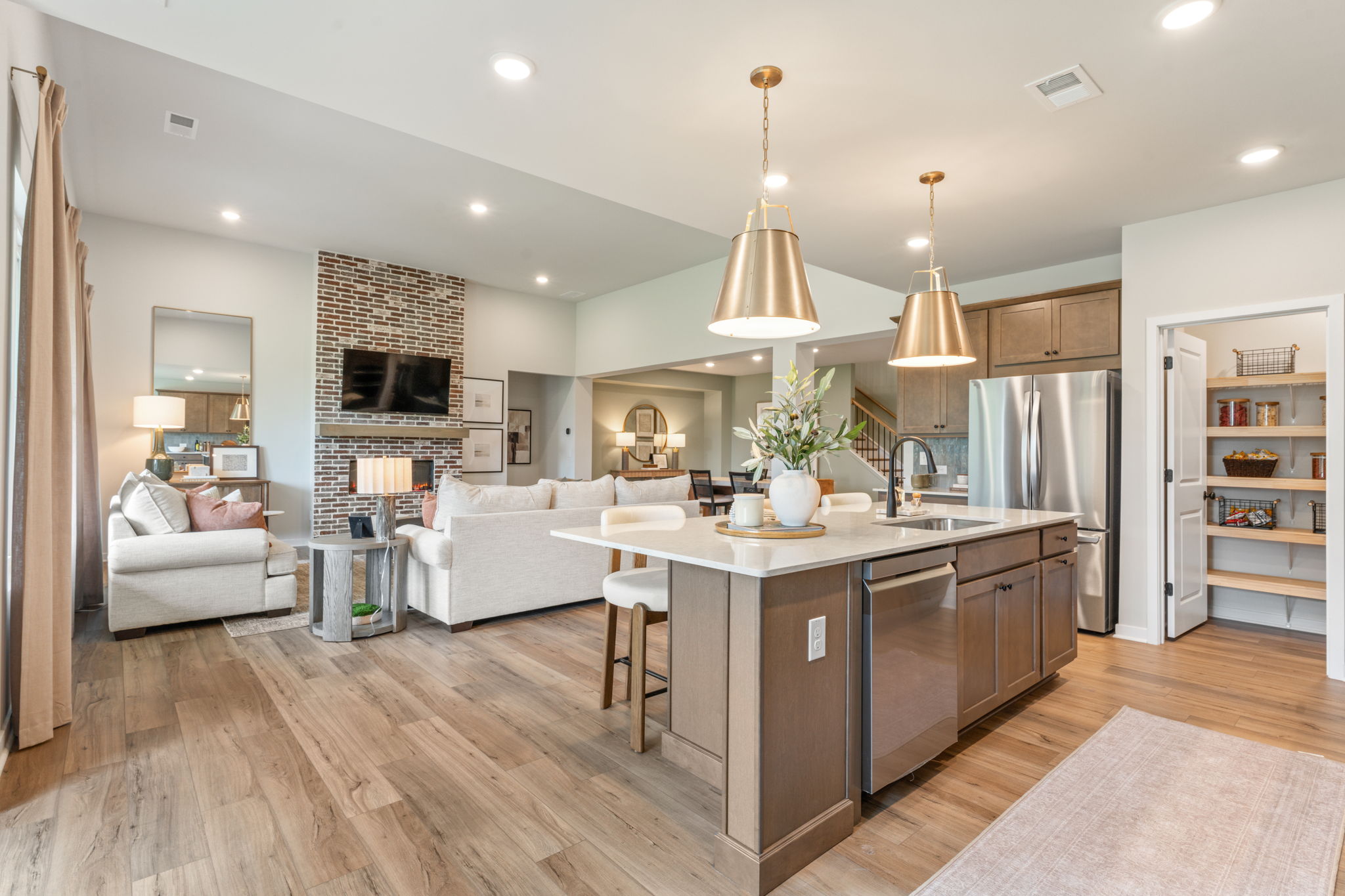 A kitchen with a bar and a couch.