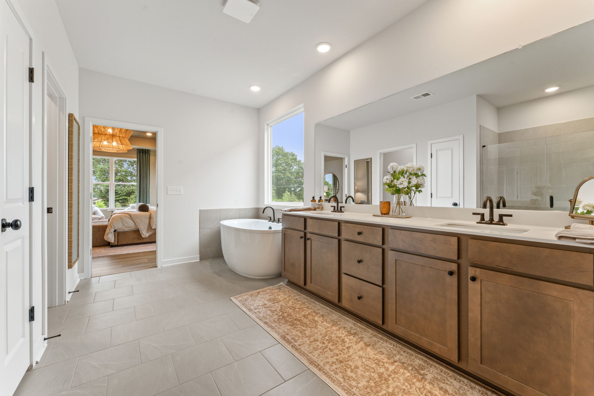 A bathroom with a tub sink and toilet.