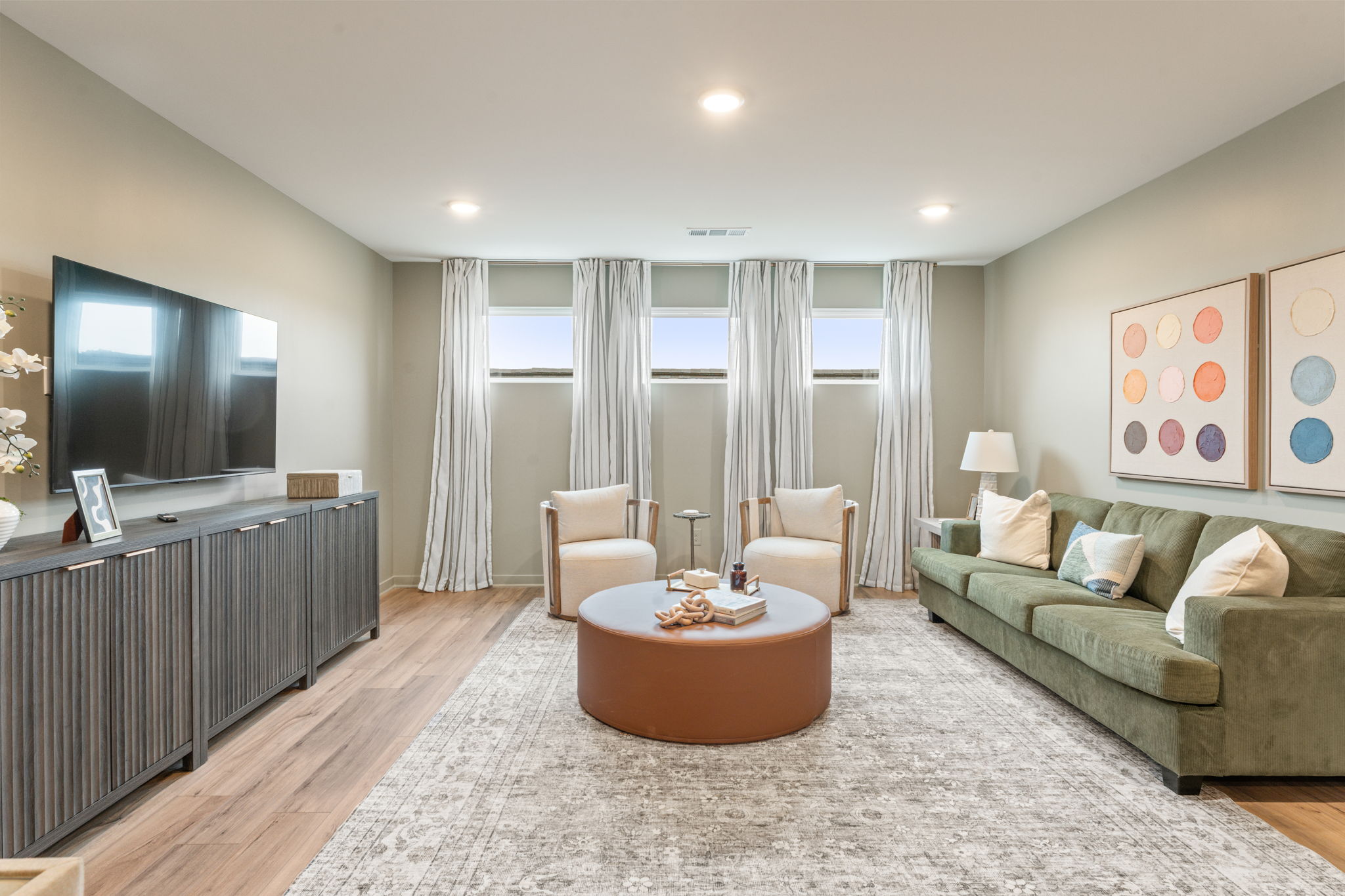 A living room with a couch and a table.