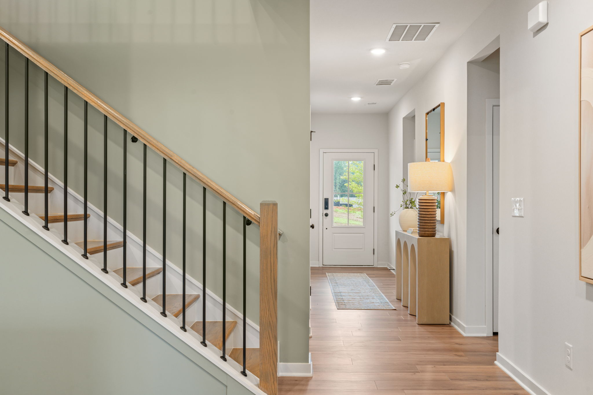 A hallway with white walls.