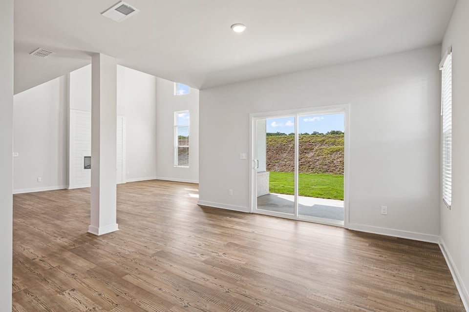 A room with a wood floor and a wood floor.