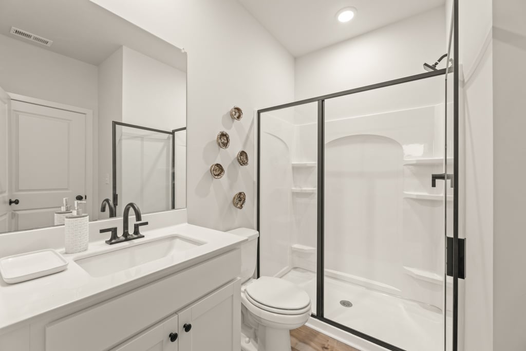 A bathroom with a glass shower.