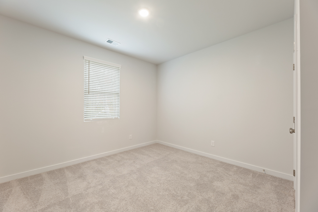 A room with a door and a window.