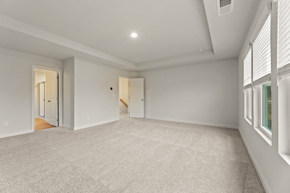 A room with white walls and windows.