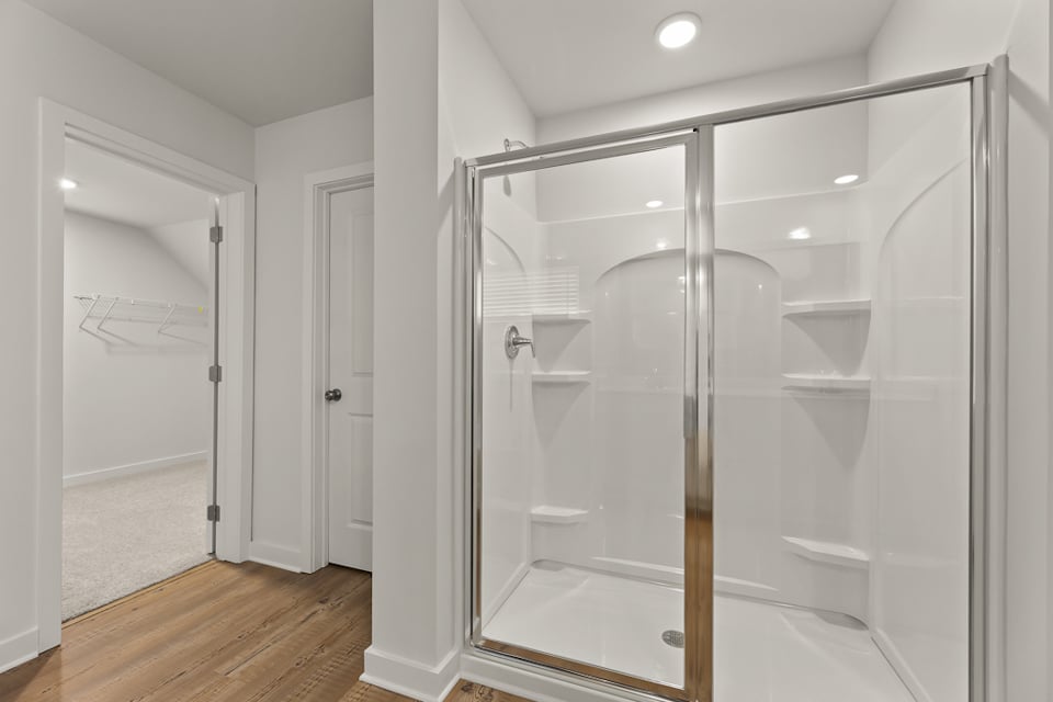 A bathroom with a glass shower.