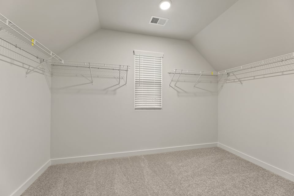 A white room with a staircase.