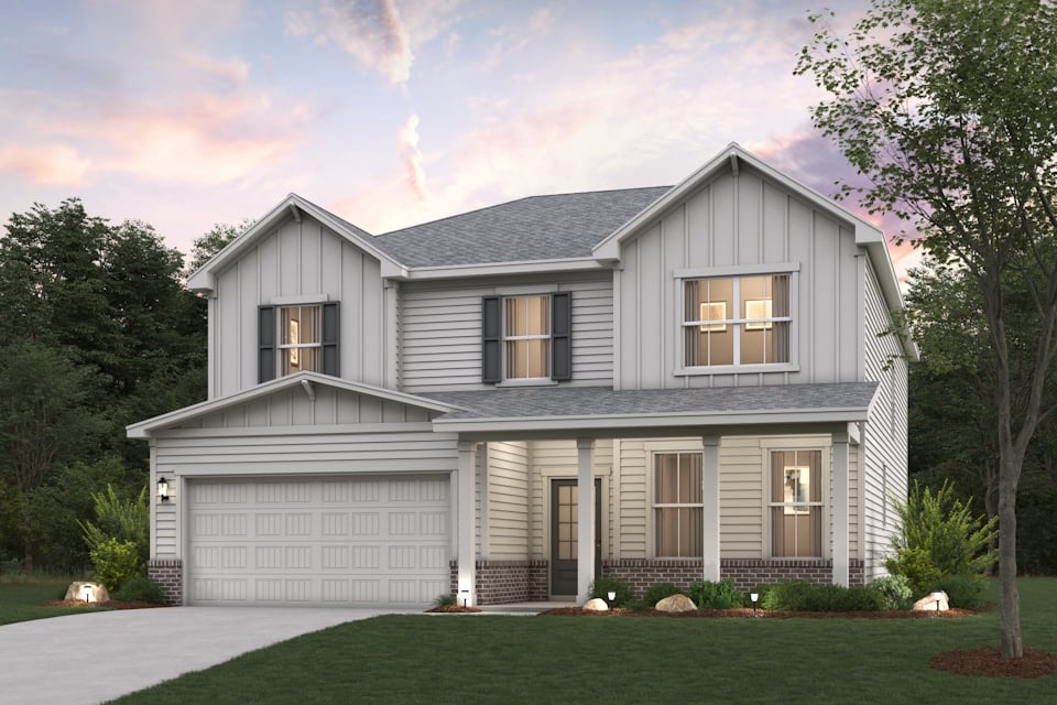 A white house with a lawn.