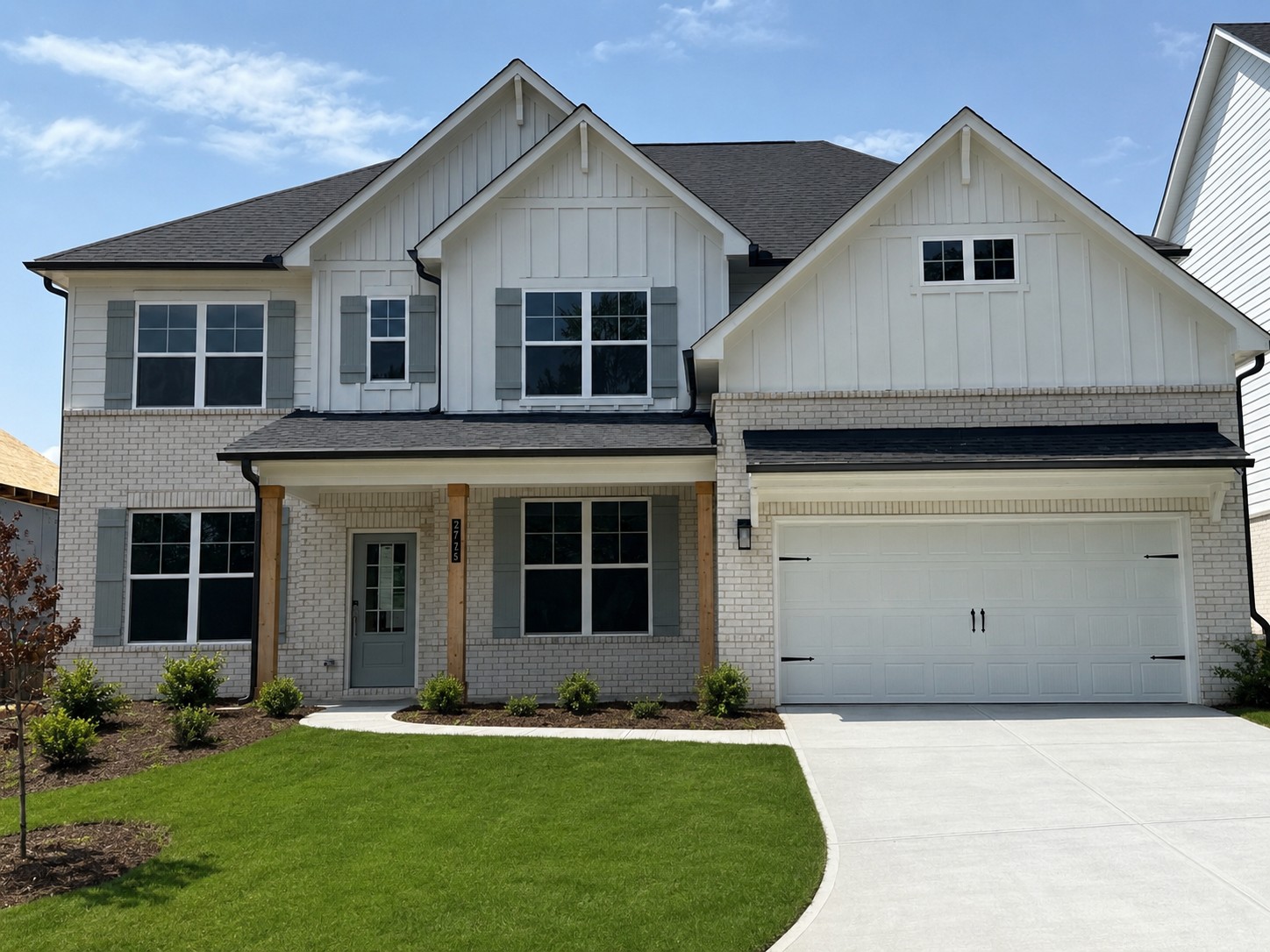 A house with a garage with Southfork Ranch in the background.