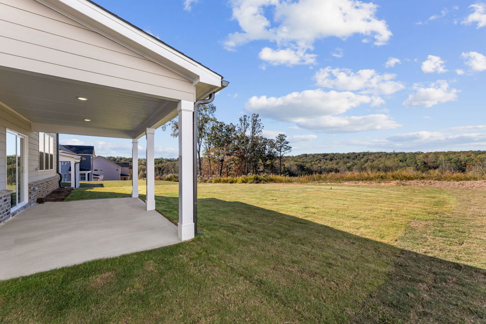 A building with a grass lawn.