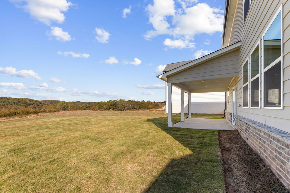 A grassy area next to a building.