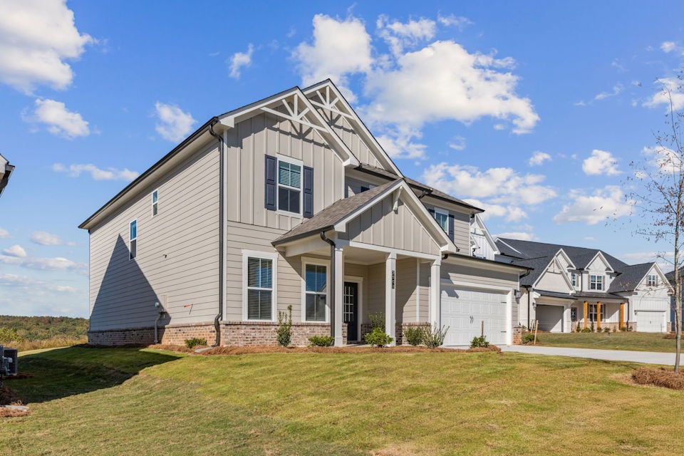 A house with a lawn in front of it.