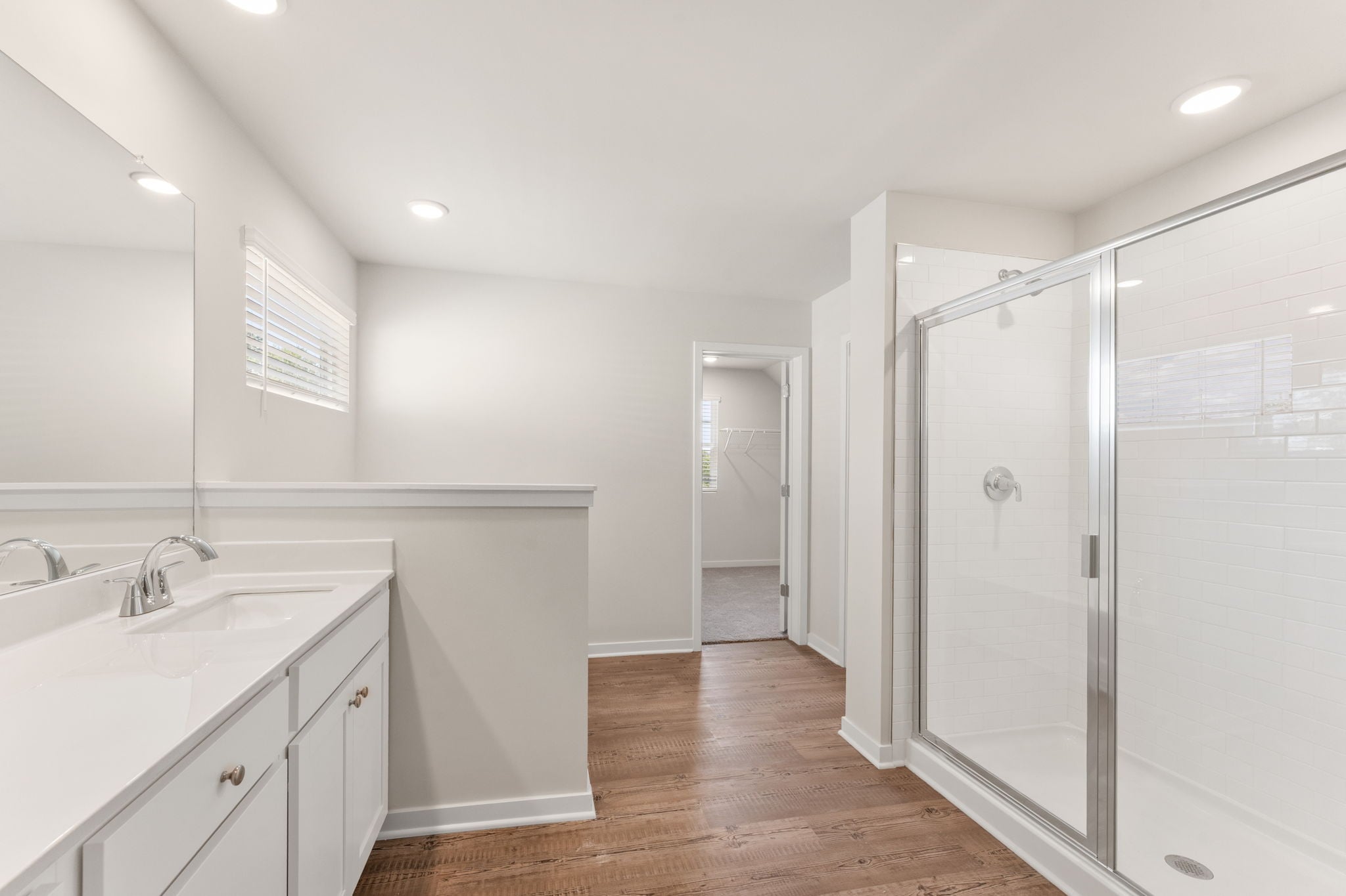 A bathroom with a glass shower.