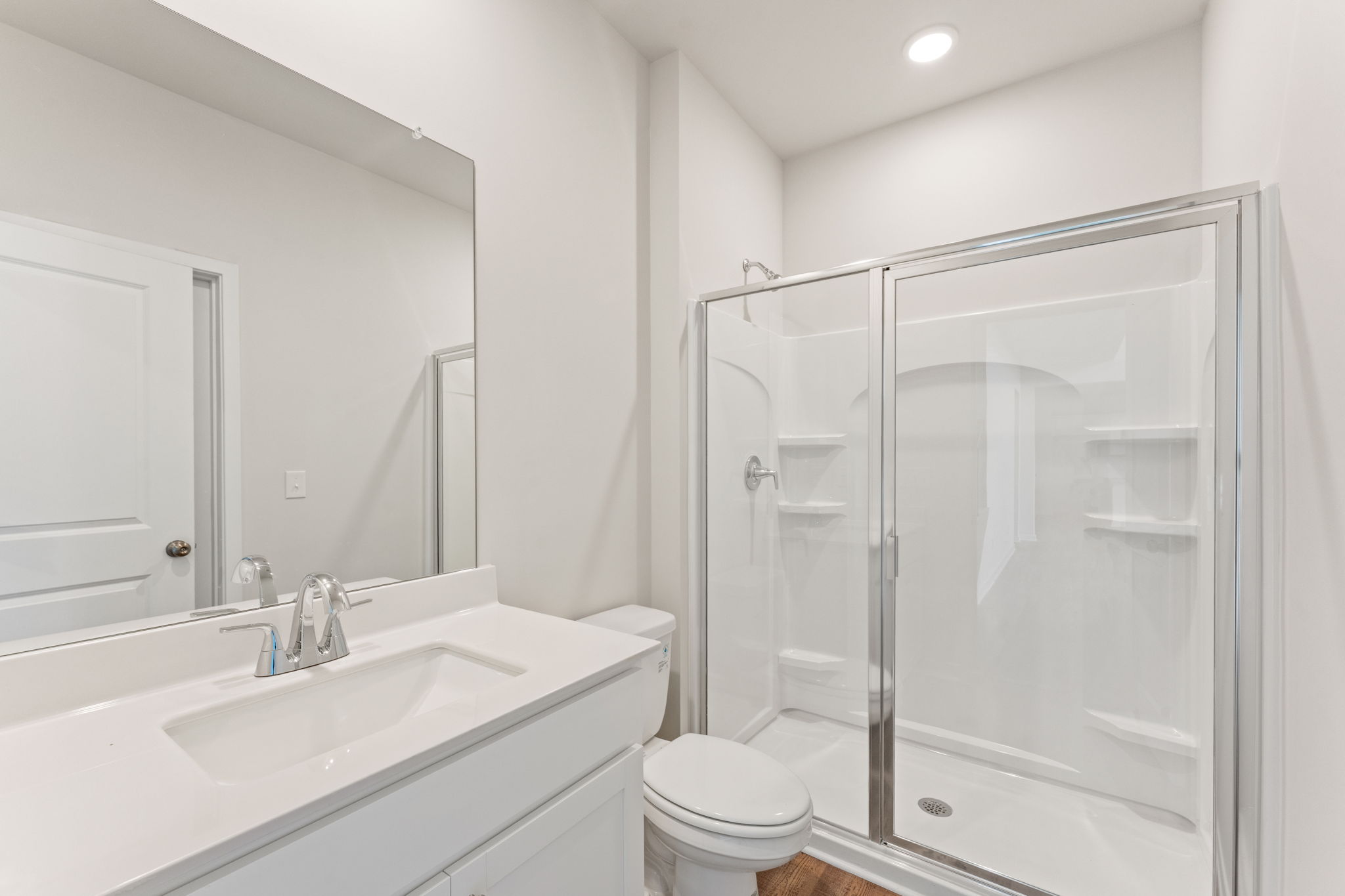 A bathroom with a glass shower.
