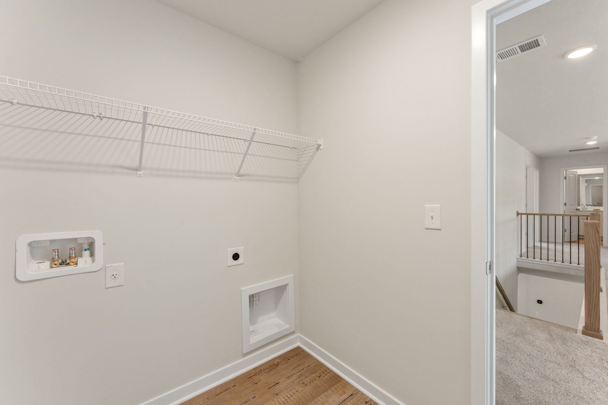 A room with a shower and a toilet.