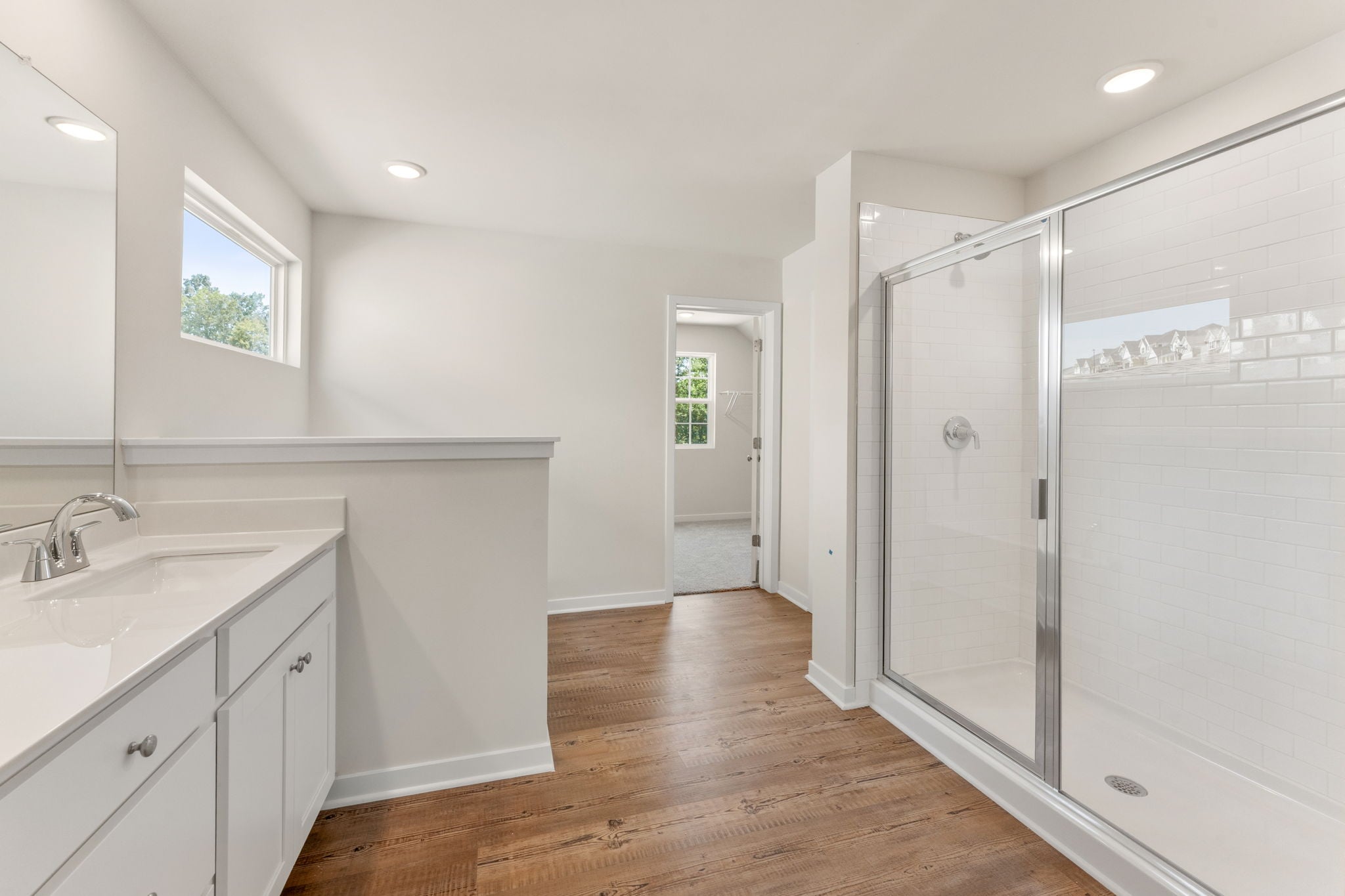 A bathroom with a glass shower.