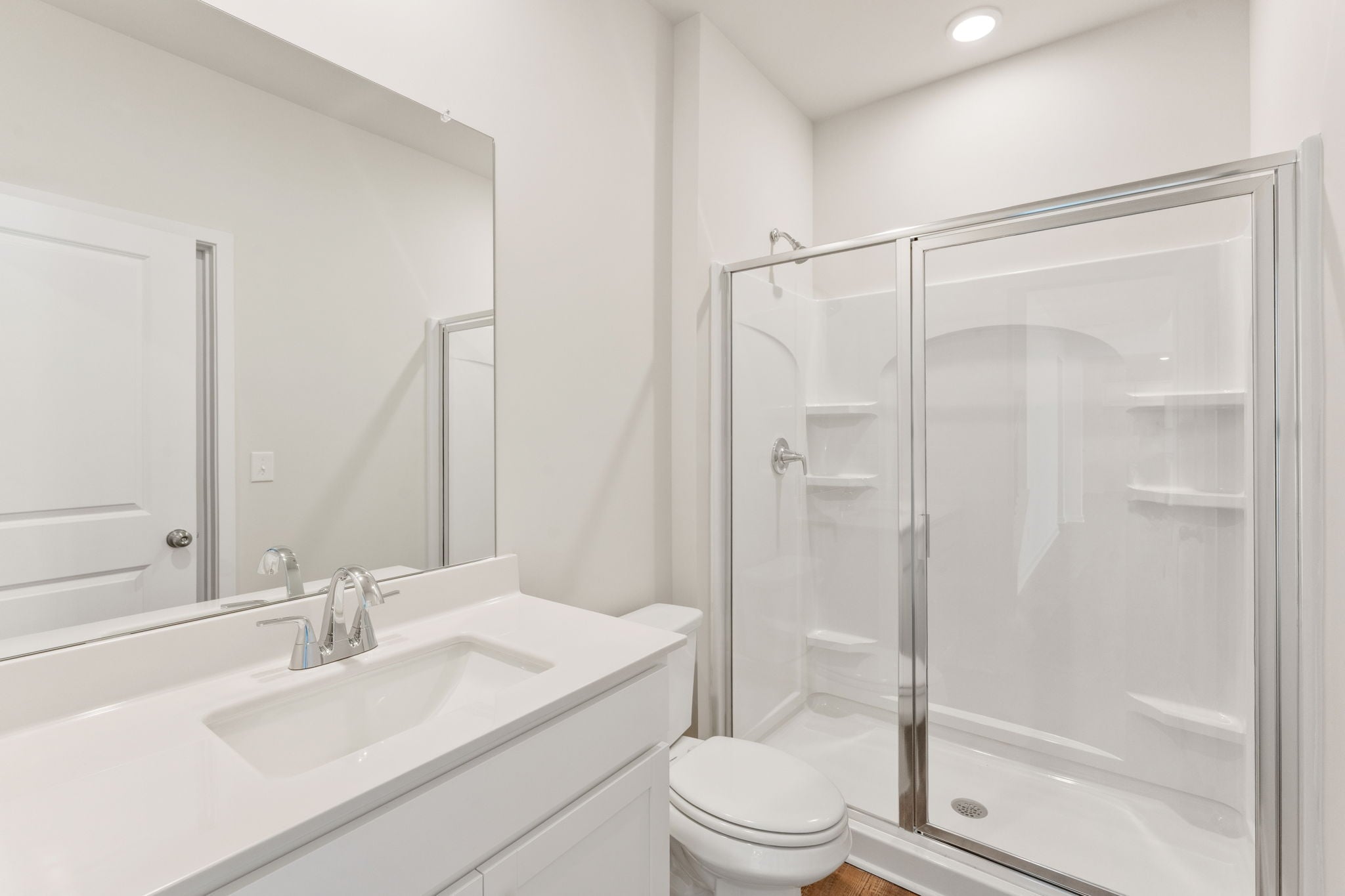 A bathroom with a glass shower.