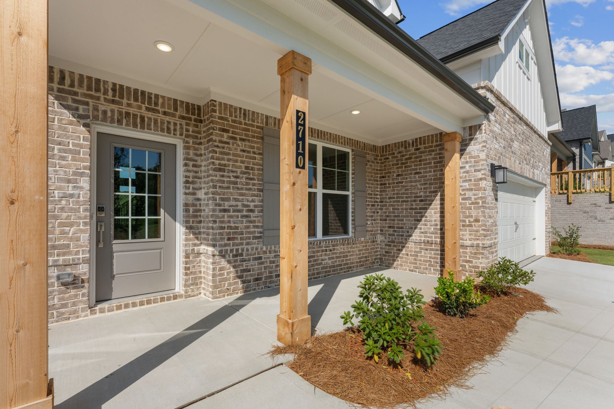 A house with a brick driveway.