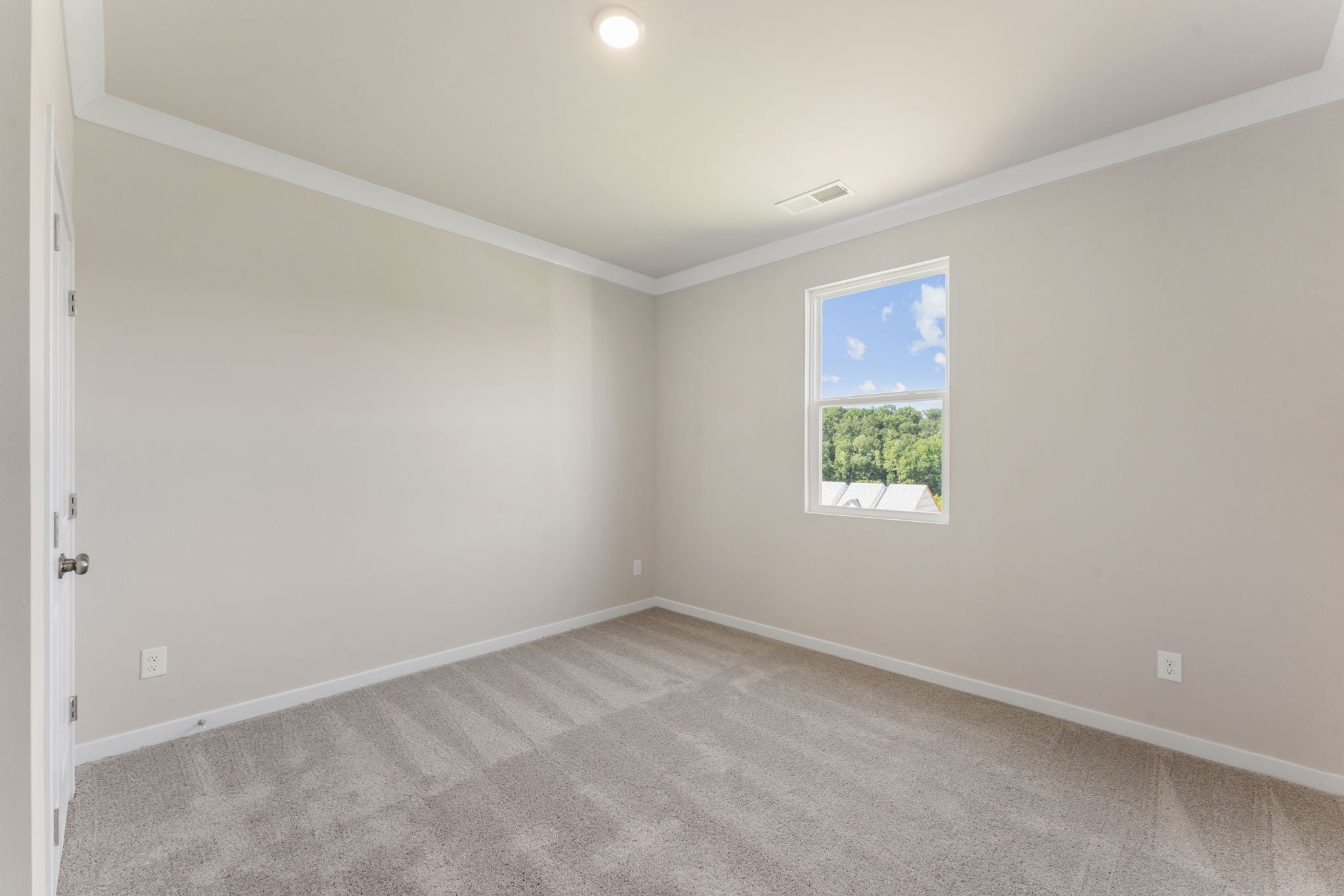 A room with a painting on the wall.