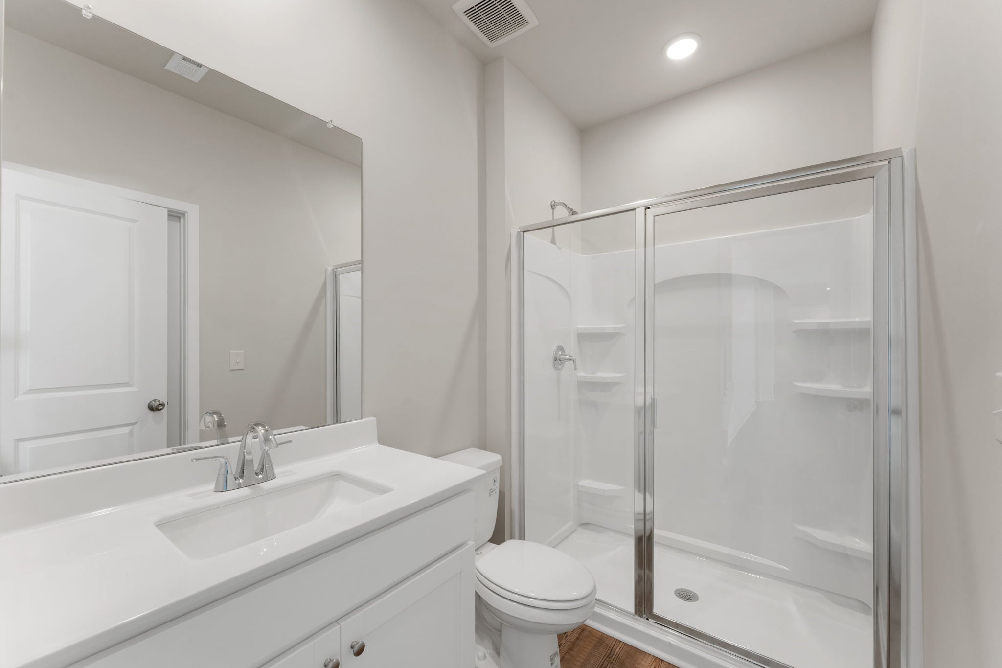 A bathroom with a standup shower.