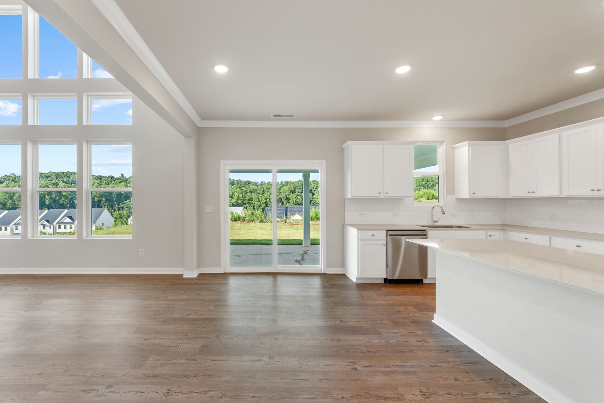 A large kitchen with white cabinets.
