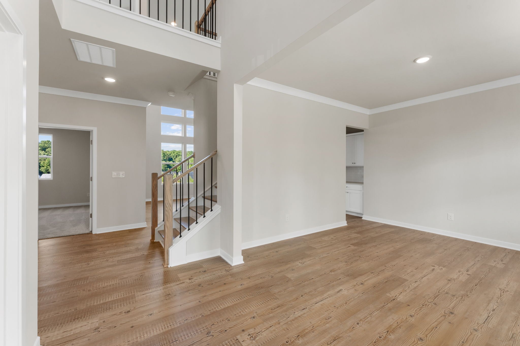 A room with a wood floor and a wood floor.