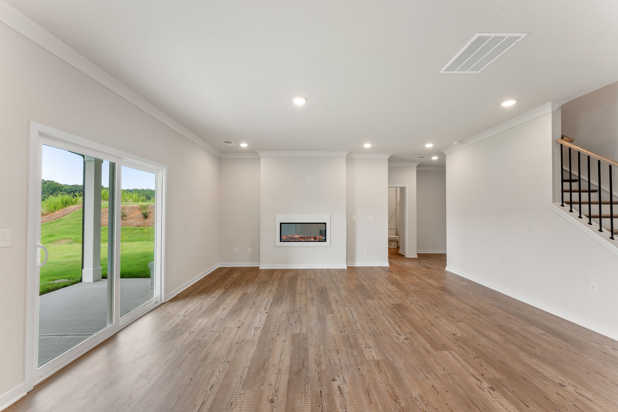 A large room with a wood floor.