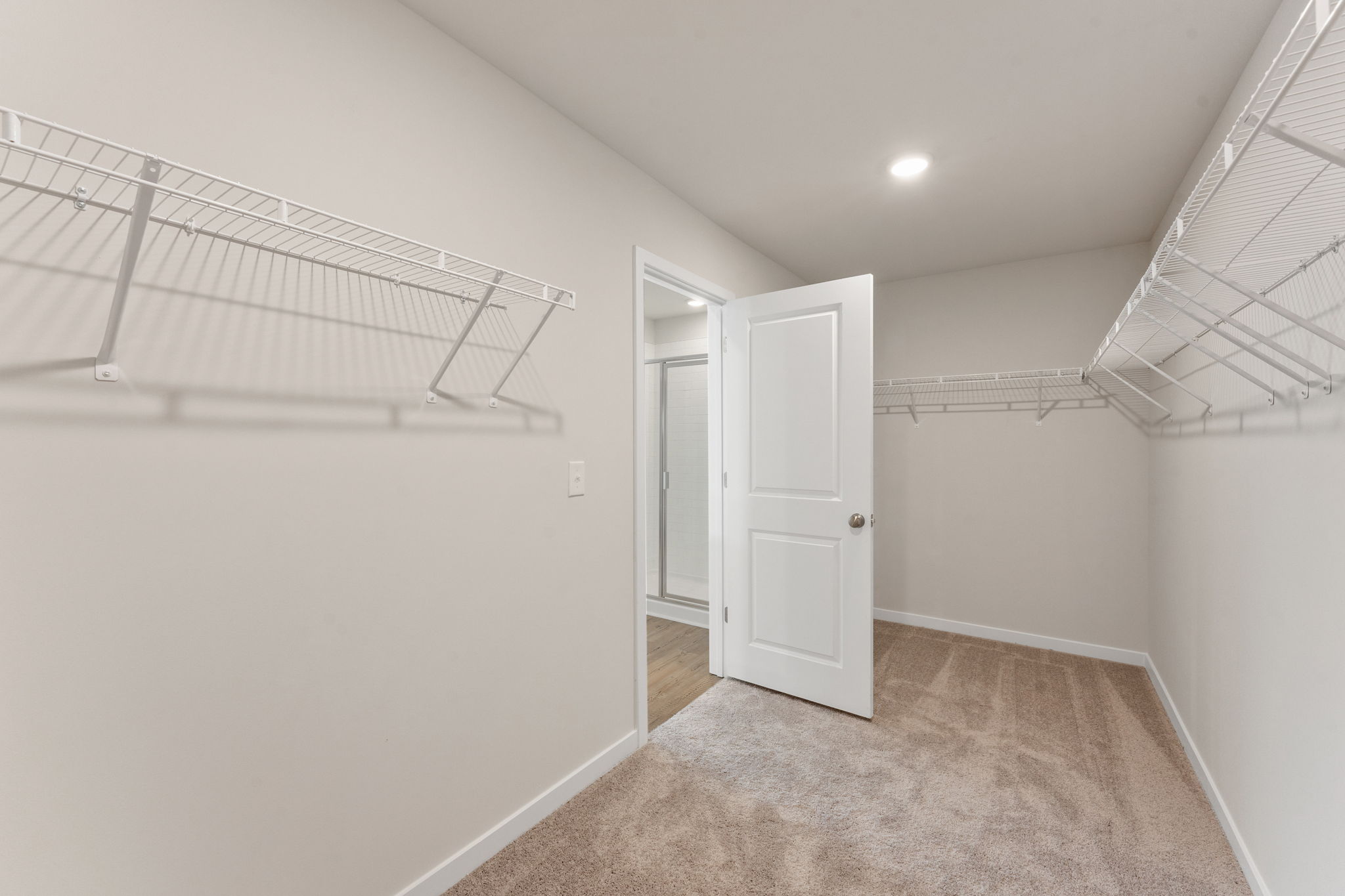A hallway with white walls.