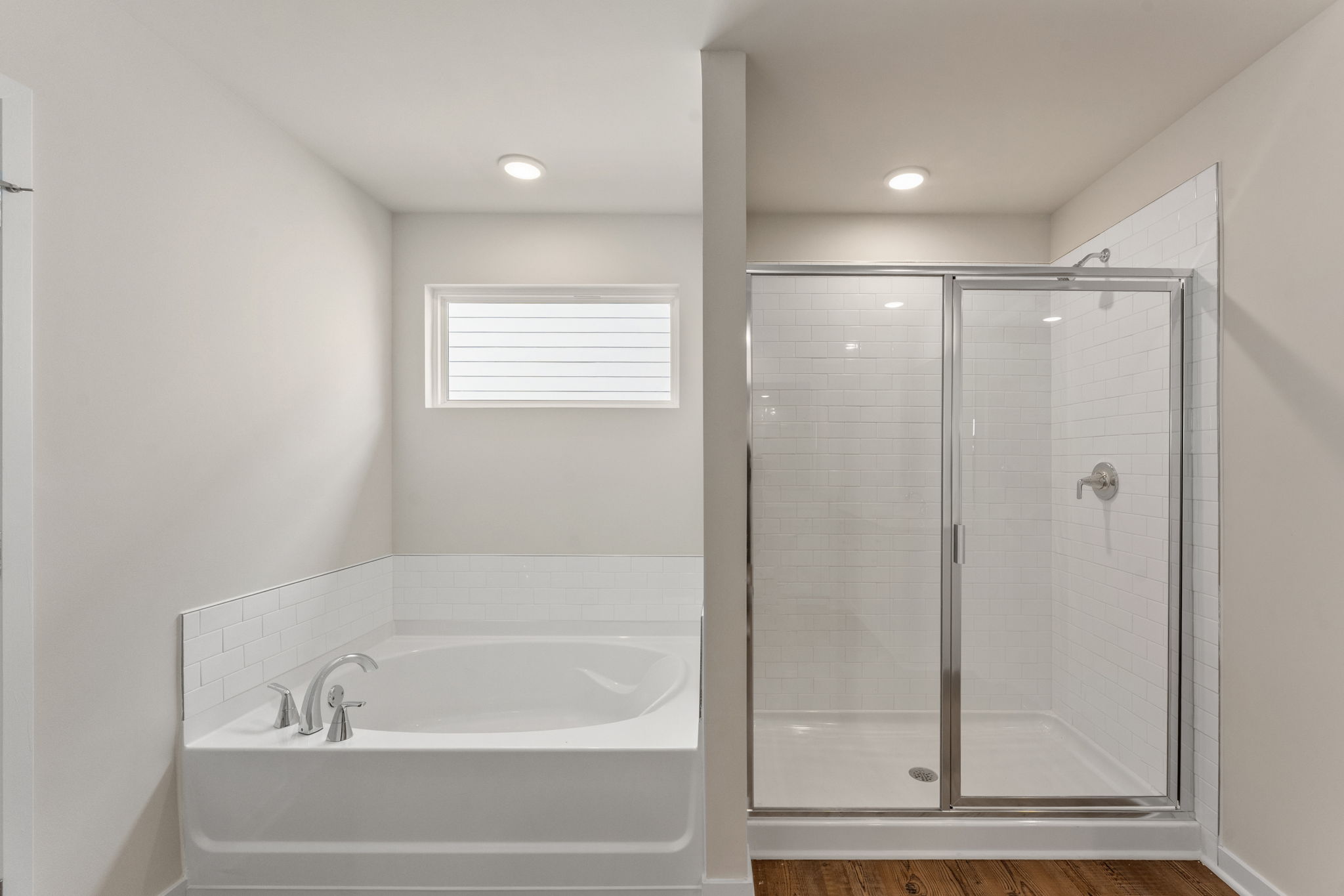 A bathroom with a glass shower.