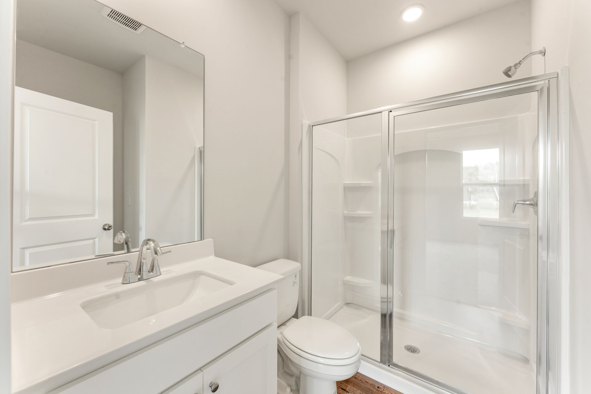 A bathroom with a glass shower.