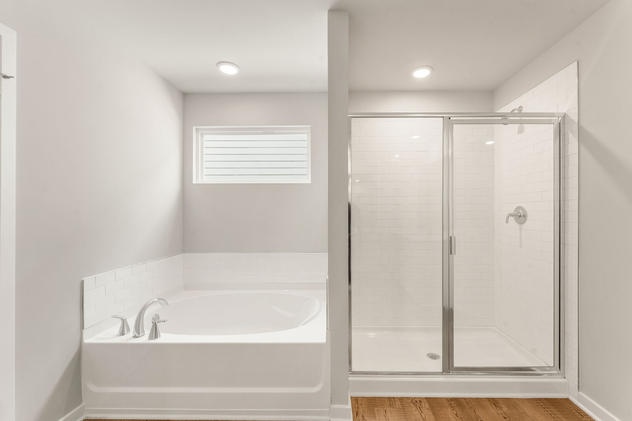 A bathroom with a glass shower.