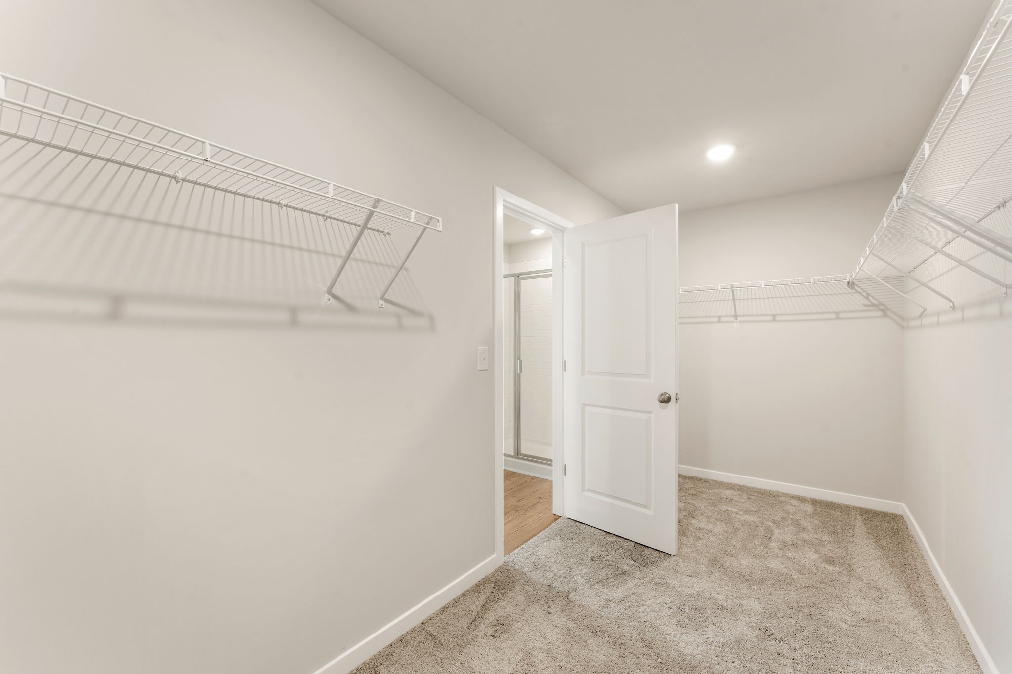 A hallway with white walls.