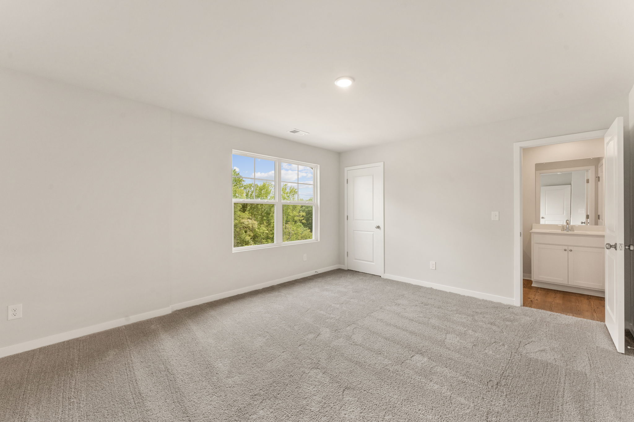 A room with a window and a door.