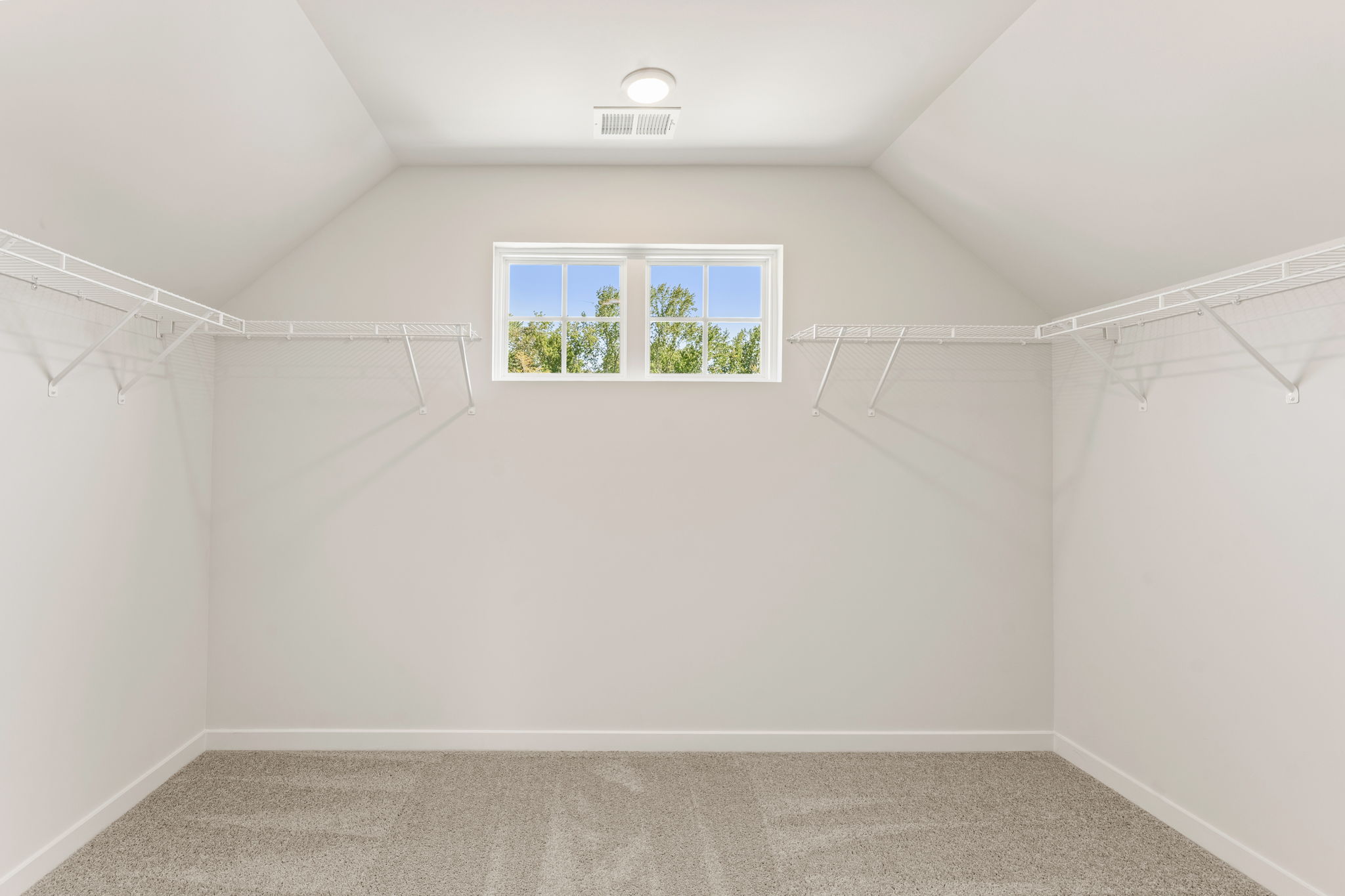 A white room with a window.
