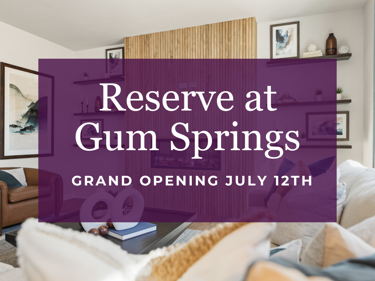 A room with a couch and a table with a book on it.