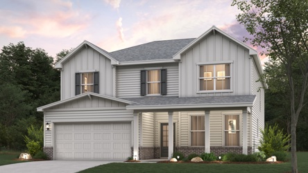 A white house with a lawn.