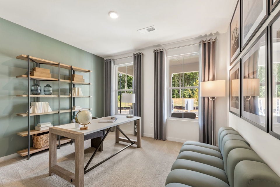 A room with a table and chairs.