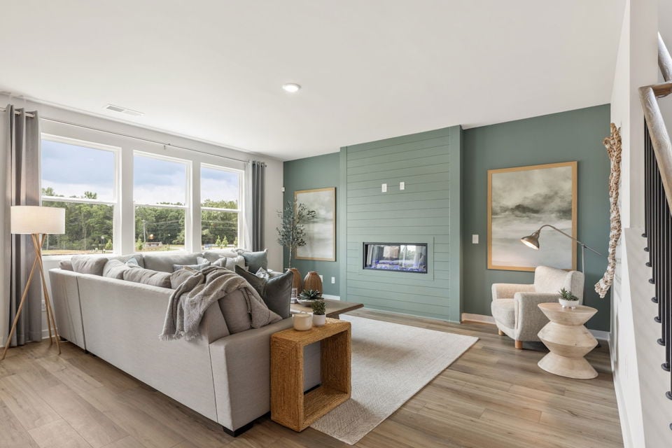 A living room with a couch and a table.