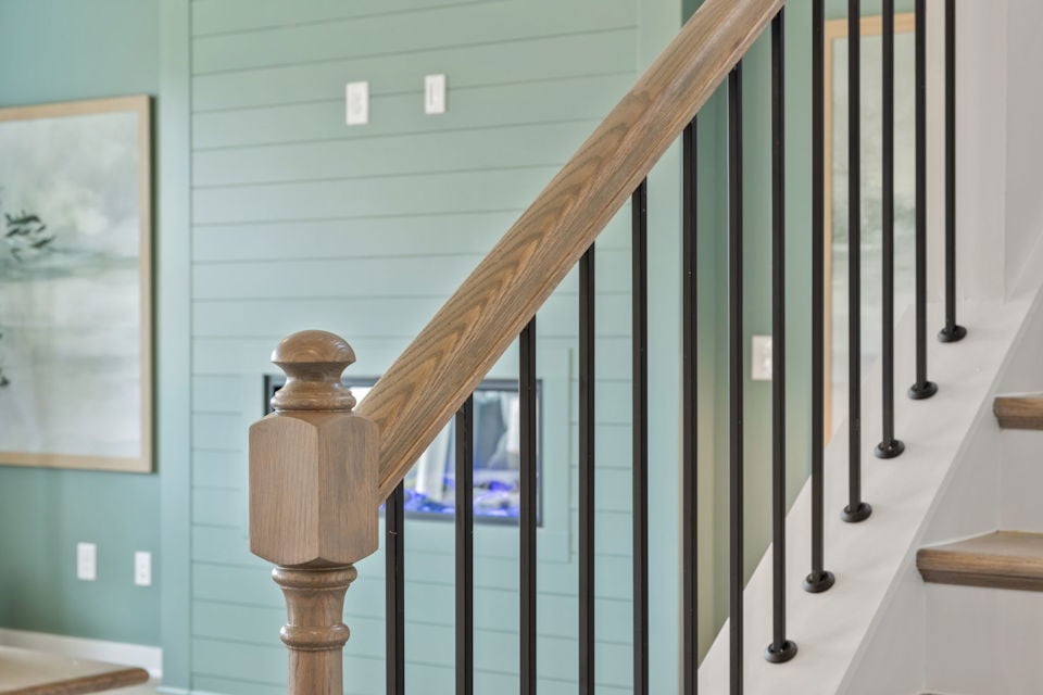 A staircase with a railing.