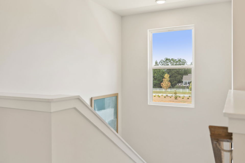 A couple of windows in a room.