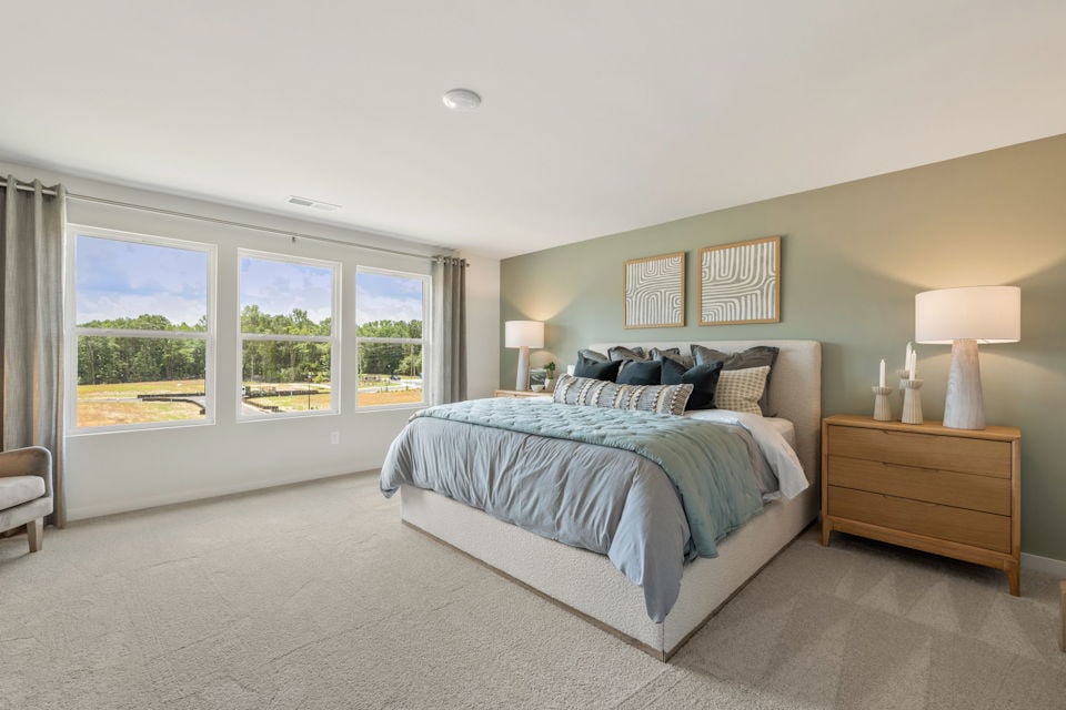 A bedroom with a large bed.