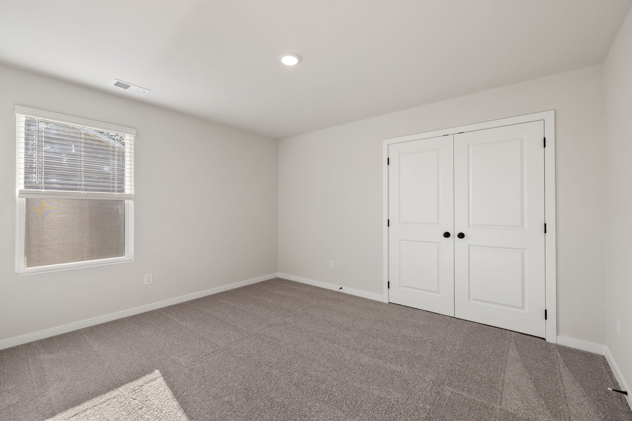 A room with white doors.