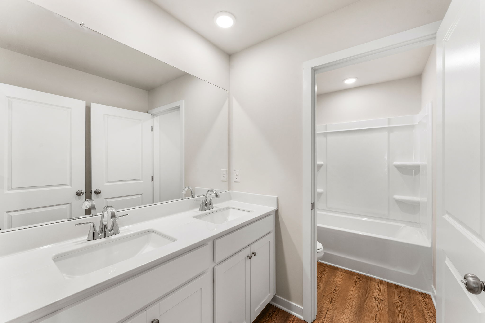 A bathroom with a glass shower.