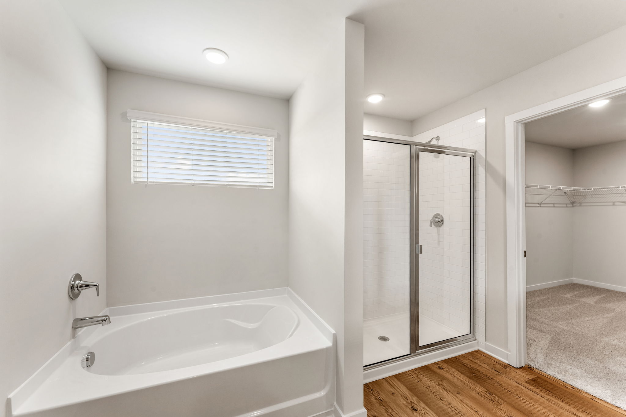 A bathroom with a glass shower.