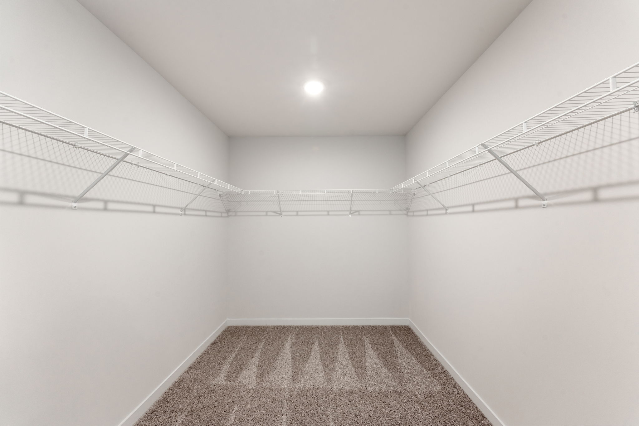 A hallway with white walls.