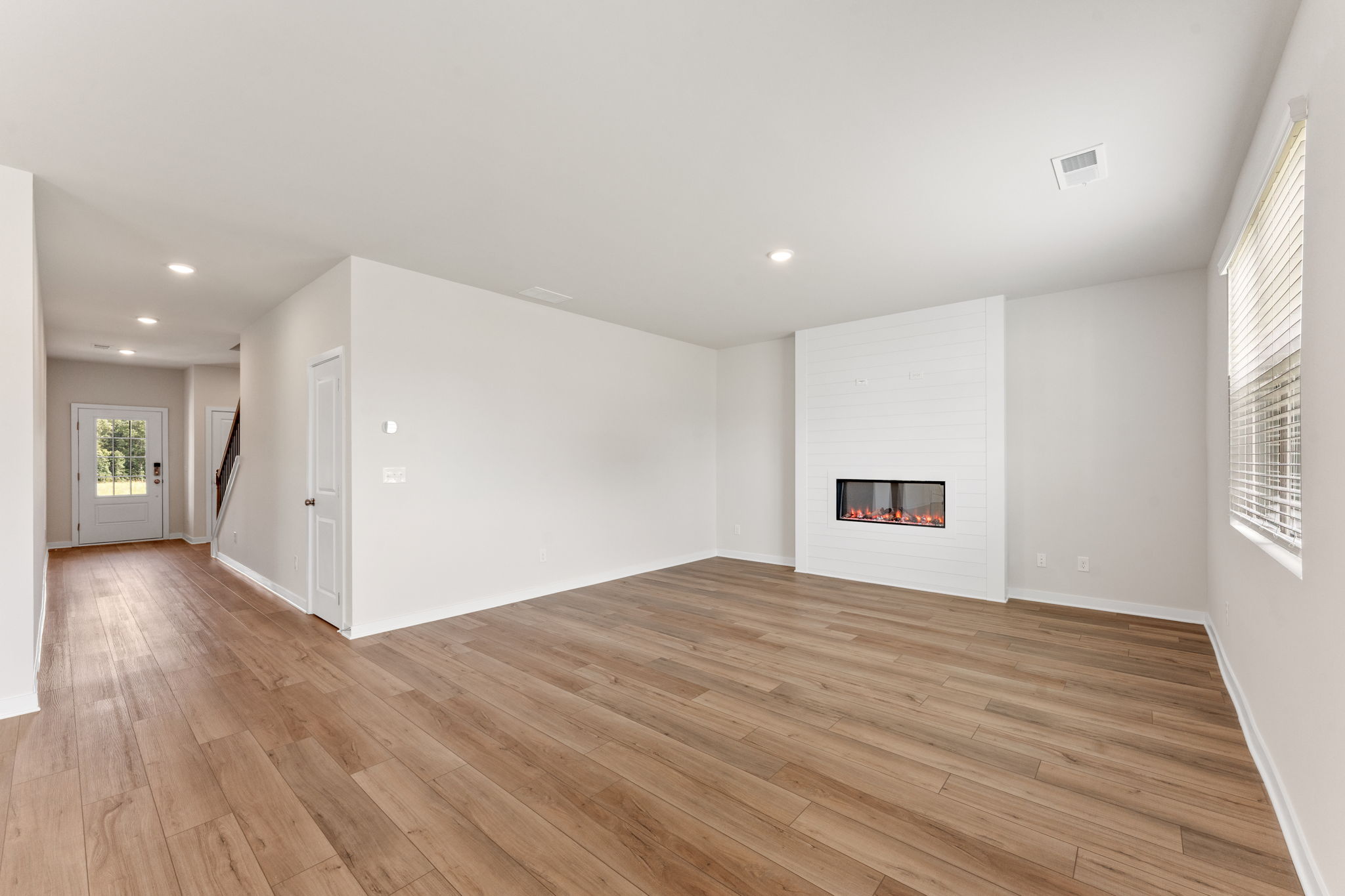 A room with a wood floor and a wood floor.